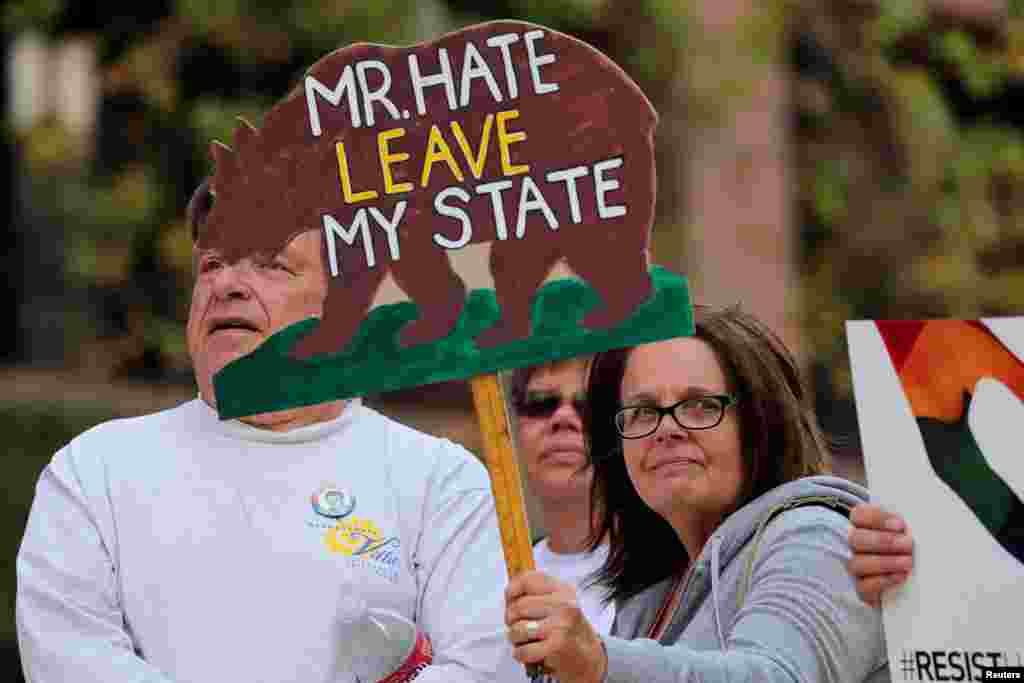 Activists and community groups hold a rally to protest the upcoming visit of U.S. President Donald Trump to California, March 12, 2018. Trump visits to view border wall prototypes in San Diego on March 13.