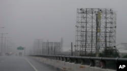 Rains and strong winds brought about by typhoon Nock-Ten hit metropolitan Manila a day after Christmas Monday, Dec. 26, 2016 at suburban Paranaque city, southeast of Manila, Philippines.