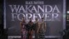 Para pemeran film Black Panther: Wakanda Forever (dari kiri ke kanan) Florence Kasumba, Danai Gurira, Letitia Wright dan Lupita Nyong'o berpose untuk para fotografer dalam acara premier film tersebut di London, pada 3 November 2022. (Foto: Vianney Le Caer/Invision/AP)