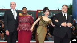 FILE - Director Guillermo Del Toro, from right, actors Sally Hawkins, Octavia Spencer and Richard Jenkins pose for photographers upon arrival at the premiere of the film "The Shape of Water" during the 74th edition of the Venice Film Festival in Venice, I