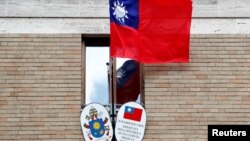 FILE -Taiwan's flag waves outside its Embassy to the Holy See, in Rome, Italy, March 14, 2018.