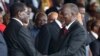 Tanzania's President-elect John Magufuli (R) meets Zimbabwe's President Robert Mugabe before his inauguration ceremony at the Uhuru Stadium in Dar es Salaam, November 5, 2015. REUTERS/Emmanuel Herman - RTX1UW3F