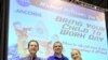 From L to R: Kelley Easley, NASA astronaut Tony Antonelli, and Erin Easley on 'Take Your Child to Work' day at the Michoud Assembly Facility on June 7, 2012.