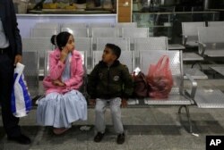 A Yemeni girl and boy wait in the departure lounge at Sanaa International airport, in Yemen, Feb. 3, 2020. A U.N. medical relief flight carrying patients from Yemen's rebel-held capital took off Feb. 2, the first such aid flight in over three years.