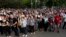 People in Belgrade, Serbia, attend a protest on May 14, 2020, after the arrest of Serbian Orthodox Church priests in Montenegro.