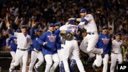 Chicago Cubs players celebrate after Game 6 of the National League Baseball championship series against the Los Angeles Dodgers at Wrigley Field Stadium, Chicago, Illinois, Oct. 22, 2016.