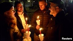 Demonstrators hold a candlelight vigil against President-elect Donald Trump's election, in Lafayette Park, near the White House, in Washington, Nov. 12, 2016. 