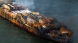 Smoke billows from the MV Solong cargo ship in the North Sea, off the Yorkshire coast in England, March 11, 2025. 