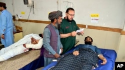 Injured men receive treatment at a hospital in Quetta, Pakistan, Oct. 11, 2024, following Thursday attack by gunmen in Balochistan province.