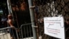 A sign informing that Tuesday testing will be canceled due to Hurricane Isaias is seen outside a community testing center for the coronavirus disease (COVID-19) in the Bronx borough of New York, Aug. 3, 2020. 