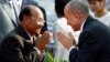 Cambodia's King Norodom Sihamoni, right, greets Heng Samrin, left, National Assembly President, before an annual royal plowing ceremony in Phnom Penh, Cambodia, file photo. 