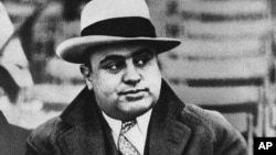 FILE - Chicago mobster Al Capone attends a football game, Jan. 19, 1931.