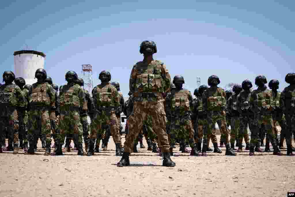 Mozambican soldiers stand as Mozambican President Filipe Nyusi and Rwanda President Paul Kagame review the troops in Pemba, Cabo Delgado province, Mozambique.