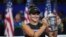 Bianca Andreescu of Canada holds up the championship trophy after defeating Serena Williams of the United States in the women's singles final of the U.S. Open tennis championships, Sept. 7, 2019, in New York.