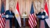 Secretary of State Antony Blinken, right, gestures, to Egyptian Foreign Minister Sameh Shoukry during a U.S.-Egypt strategic dialogue at the State Department, Nov. 8, 2021.