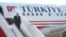 FILE - Turkish President Recep Tayyip Erdogan disembarks from his plane, Oct. 22, 2019. 