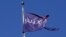 A flag bearing the Yahoo company logo flies above a building in New York, Oct. 31, 2016. The European Commission has asked the U.S. about a secret court order Yahoo used to scan thousands of customer emails.