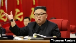 North Korean leader Kim Jong Un speaks during the opening of the 3rd Plenary Meeting of the 8th Central Committee of the Workers' Party of Korea
