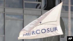 FILE - A Mercosur banner flies outside the Planalto Presidential Palace in Brasilia, Brazil.