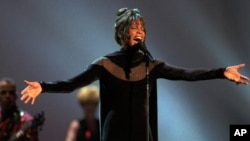 Whitney Houston performs during the 21st annual American Music Awards at the Shrine Auditorium Feb. 7, 1994 in Los Angeles.