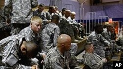 U.S. Army soldiers await departure for their deployment to Afghanistan in Fort Carson, Colorado