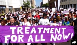 Civil rights activists march in Durban, South Africa, at the start of the 21st World Aids Conference, July 18, 2016.