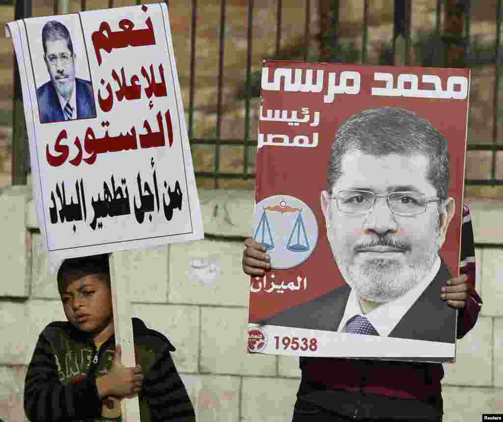 Muslim Brotherhood members and supporters of Egyptian President Mohamed Morsi chant pro-Morsi slogans, during a rally in front of the Sultan Hassan and Refaie mosques in the old town of Cairo, November 30.