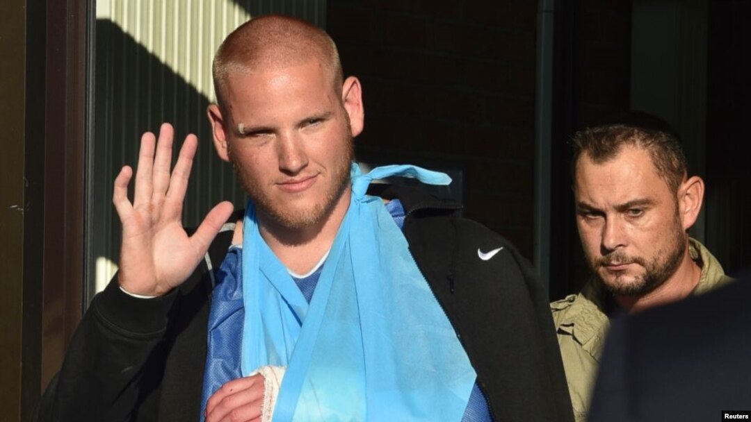 FILE - U.S. serviceman Spencer Stone waves as he departs the Clinique Lille Sud, which specializes in hand injuries, in Lesquin, France, Aug. 22, 2015. 