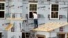Reports: US Job Market Improves; Housing Sector Falters
