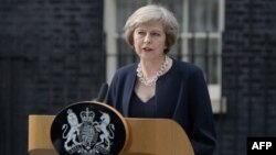 Theresa May memberikan pidato pertama sebagai perdana menteri Inggris di London, Rabu (13/7). 