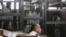 Defendants who are in custody stand in the accused cells during the trial of 20 individuals, including five Al-Jazeera journalists, for allegedly defaming the country and ties to the blacklisted Muslim Brotherhood on May 3, 2014.