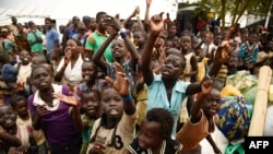 FILE - Children refugees from the Democratic Republic of Congo start singing before registration process at Kyangwali Refugee Settlement in Kyangwali, western Uganda, on December 10, 2018.