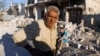 A man near his destroyed house after a recent Syrian Air Force air strike in Azaz, Syria, August 20, 2012. 