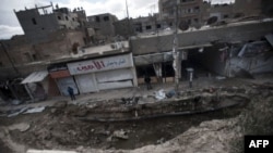 Site of massive bomb allegedly dropped by pro-government war planes in eastern Syrian city of Deir Ezzor, Feb. 16, 2013