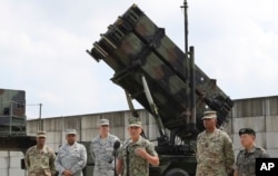 U.S. Pacific Command Commander Adm. Harry Harris, third from right, answers a reporter's question during a press conference in front of PAC-3 launching station at Osan Air Base in Pyeongtaek, South Korea, Aug. 22, 2017.