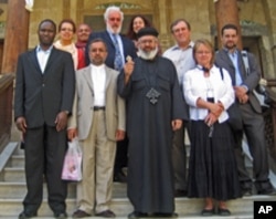 2010 Citizen Diplomat Award honoree Sahar Taman (back row in red) visits an Egyptian Coptic church with one of her tour groups in May 2009.