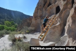 Mikah Meyer explores one of several thousand ancestral Pueblo dwellings that have been carved out within the sheer-walled canyons at Bandelier National Monument.