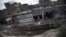 Site of massive bomb allegedly dropped by pro-government war planes in eastern Syrian city of Deir Ezzor, Feb. 16, 2013