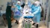 medical staff in protective suits