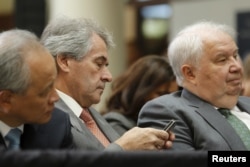 FILE - Russia's Ambassador Sergey Kislyak from right, U.K. Ambassador Peter Westmacott and China's Ambassador Cui Tiankai wait for U.S. President Barack Obama to deliver remarks on a nuclear deal with Iran at American University, Aug. 5, 2015.