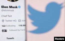 FILE PHOTO: Illustration shows Elon Musk's account and Twitter logo