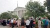 FILE - People stand in line hoping to enter the Supreme Court in Washington, Friday June 26, 2015. 