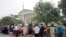 FILE - People stand in line hoping to enter the Supreme Court in Washington, Friday June 26, 2015. 