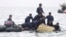 Indonesian Navy divers pull out a part of an airplane out of the water during a search operation for the Sriwijaya Air passenger jet that crashed into the sea near Jakarta.