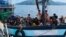 Langkawi ကျွန်းရှိ မလေးရှားပိုင်နက်အတွင်းမှာ တွေ့ရတဲ့ လှေစီးပြေး ရိုဟင်ဂျာတချို့ (ဓာတ်ပုံ - AFP PHOTO / MALAYSIAN MARITIME ENFORCEMENT AGENCY)