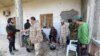 Para kombatan yang setia kepada pemerintah Libya yang diakui oleh internasional, GNA, beristirahat di sebuah tempat di selatan Ibu Kota Libya, Tripoli, 12 Januari 2020. Pihak-pihak yang bertikai di Libya setuju untuk gencatan senjata.