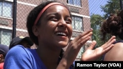 Taina Figueroa, a rising eighth-grader and star Harlem RBI player, watches the 2016 summer championship game, in New York, Aug. 12, 2016.