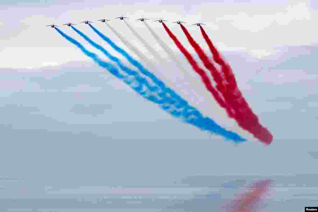 French Air Force Patrouille de France Team performs at the official opening ceremony of the British Normandy Memorial at Ver-sur-Mer, on the 77th anniversary of D-Day, France.