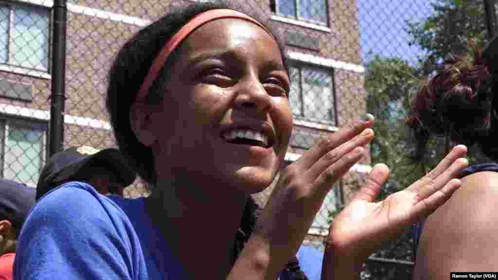 Taina Figueroa, a rising eighth-grader and star Harlem RBI player, watches the 2016 summer championship game, in New York, Aug. 12, 2016.