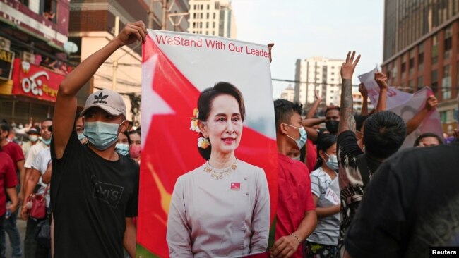 Demonstrators protest against the military coup and demand the release of elected leader Aung San Suu Kyi, in Yangon, Myanmar, Feb. 6, 2021.